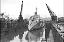 HMCS Prince Robert, one of three Canadian National Steamship liners converted into armed merchant cruisers by the RCN as a stopgap in 1940, is pictured here, in a British drydock in January 1944, after later conversion as an anti-aircraft cruiser.
