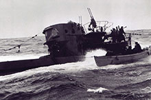 A boarding party from the corvette Chilliwack comes alongside U-744, 6 March 1944.