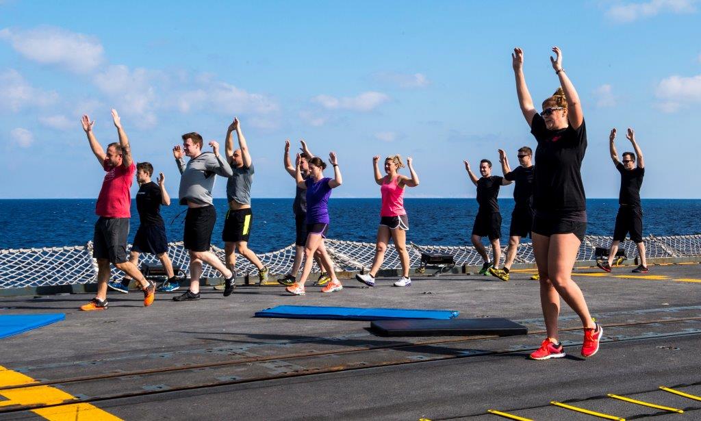 Members of HMCS Fredericton participate in a fitness routine during Operation REASSURANCE.