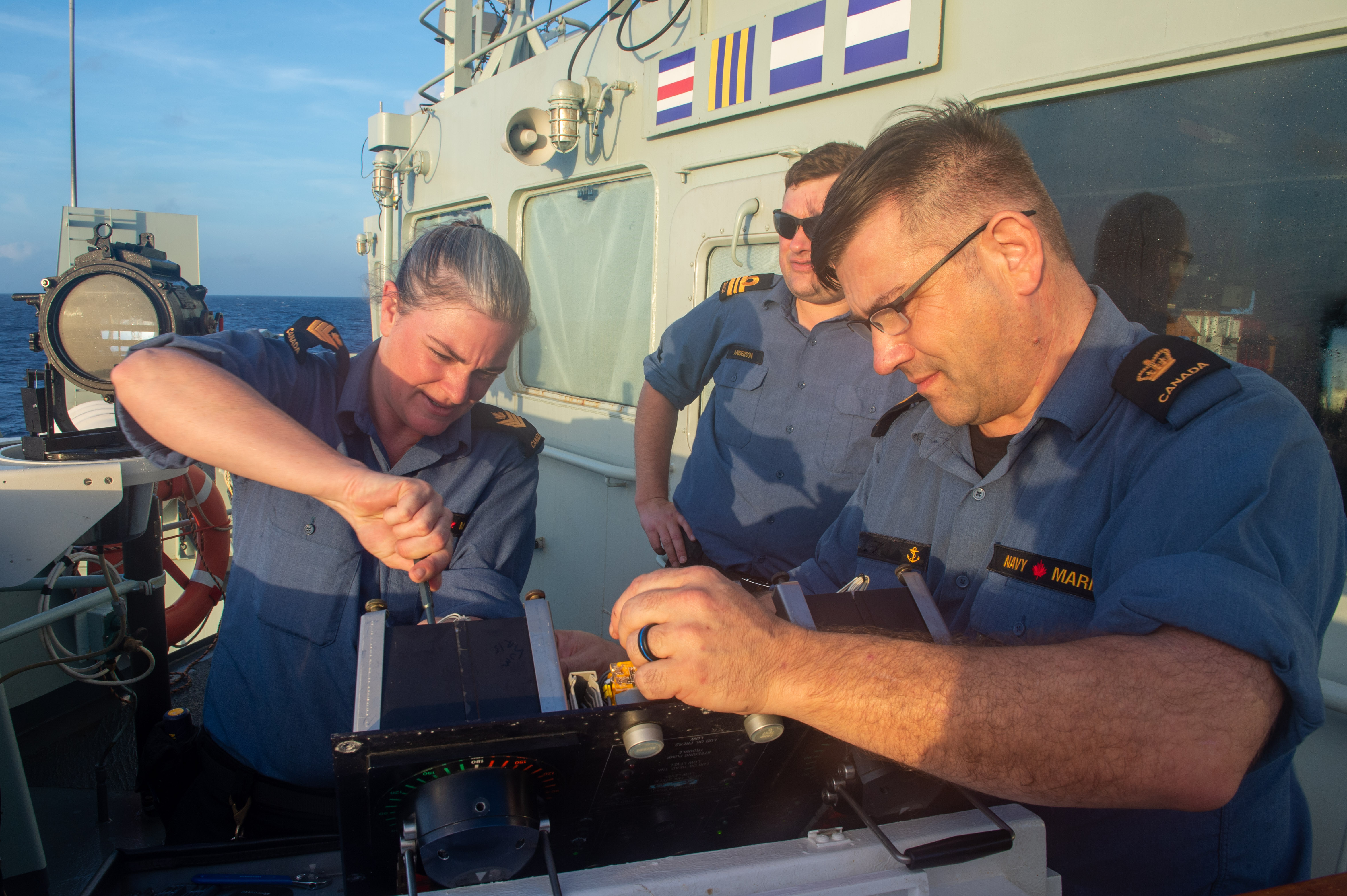 Image has been digitally altered for operational security purposes.
 
HMCS Summerside crew members work on the helm console during Operation CARIBBE, in the Atlantic Ocean on October 29, 2020.