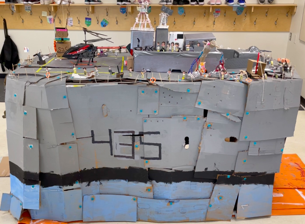 As part of the Ship to Shore program, Ms. Sarah Kessler’s grade 4 class at Douglasdale School made a model of a Halifax-class frigate, complete with a mini Oscar, the sailor overboard dummy.