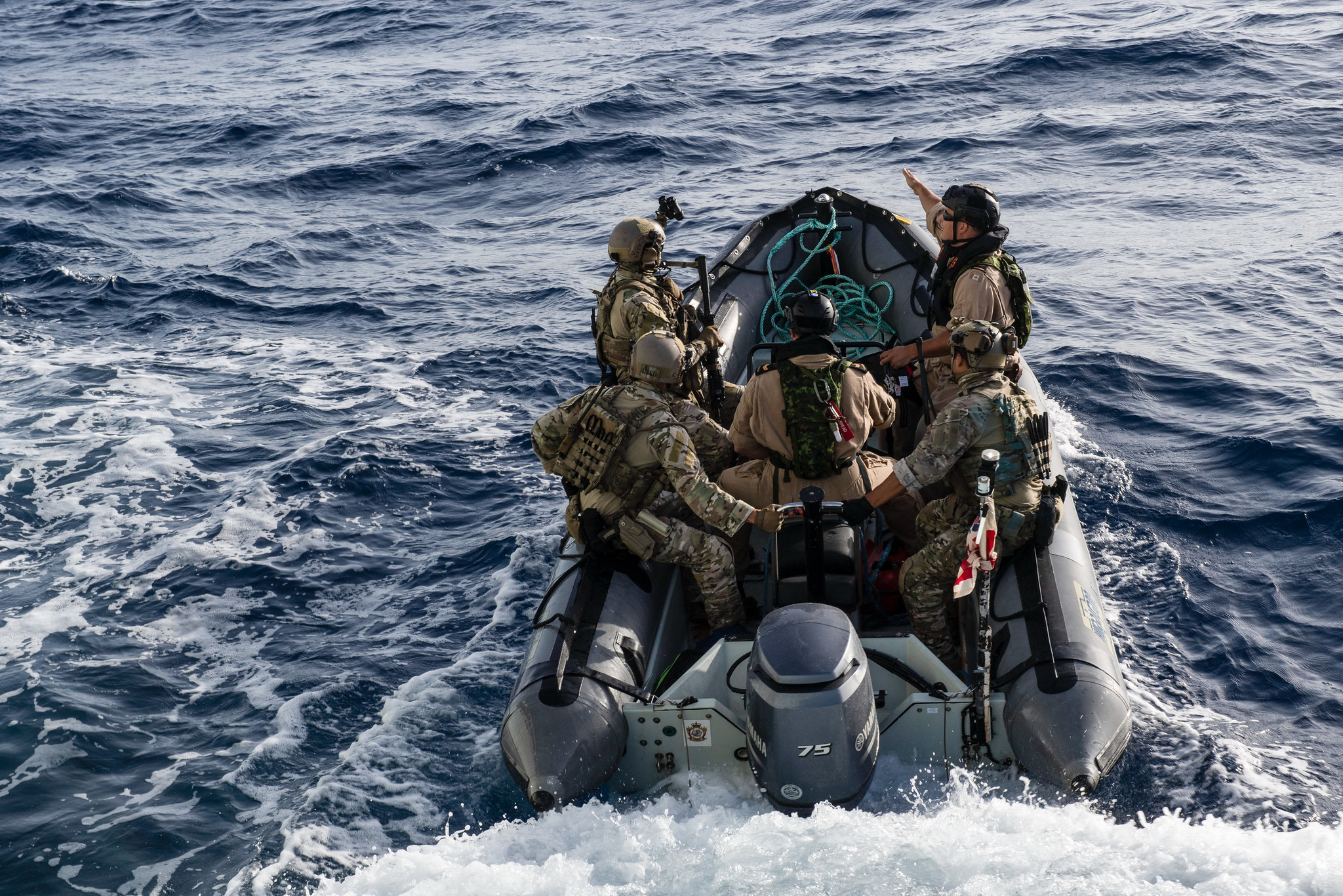 Sailors and U.S. Coast Guard LEDET members aboard HMCS Shawinigan deploy on the RHIB to encounter a vessel of interest suspected of carrying illegal contraband during Operation Caribbe on July 21.